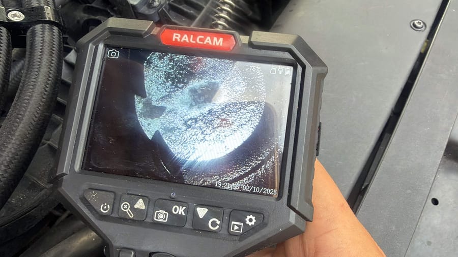 Borescope camera in use on an engine